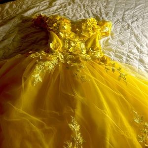 A yellow gown with corset top sleeveless